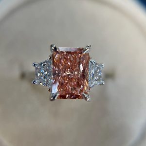 Pink and white diamond three-stone ring